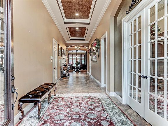 Gorgeous from the moment you open up the front door! Custom painted ceilings with accent lighting.