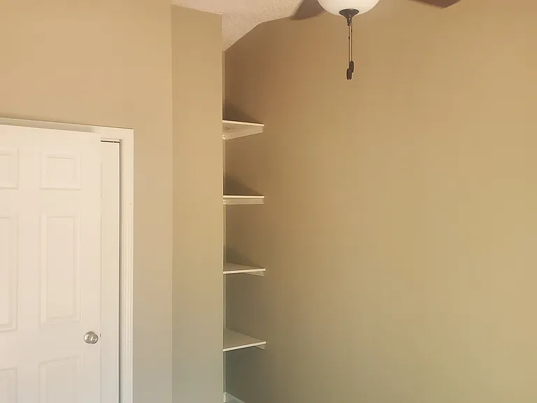 Third bedroom built-in shelves.