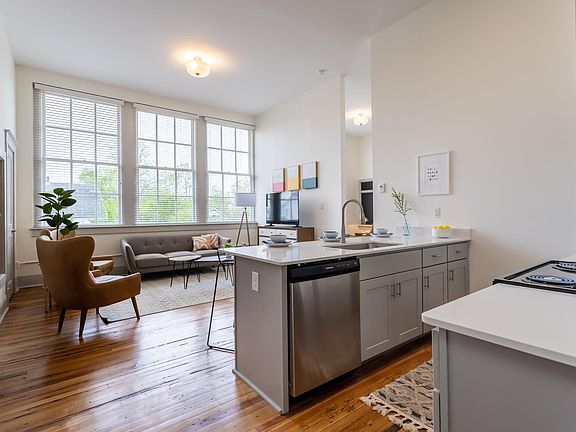Historic features include original hardwood floors in some units, custom built-in cabinetry, and chalkboards