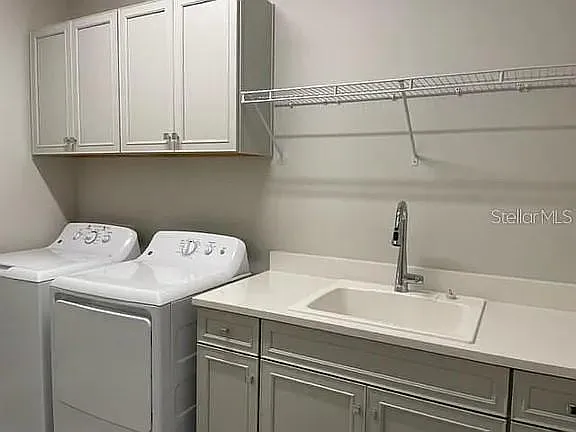 Well-appointed laundry room complete with washer & dryer!