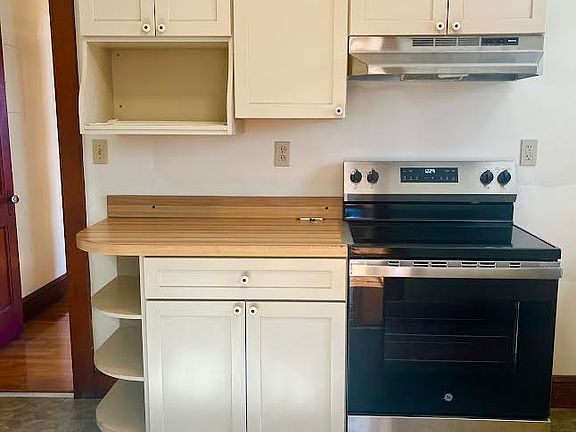 New stove and stainless refrigerator