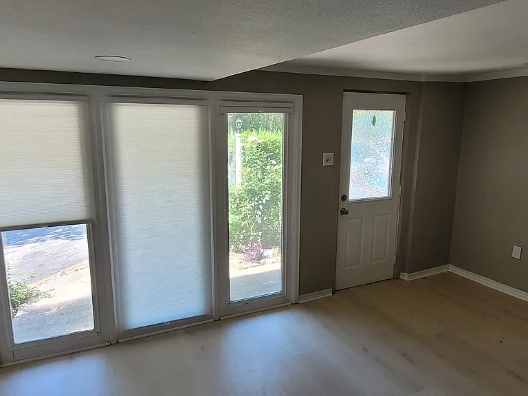 Picture of front room (Rm #1) looking at the front door. Space is still being fixed up, so more pictures and video to come.