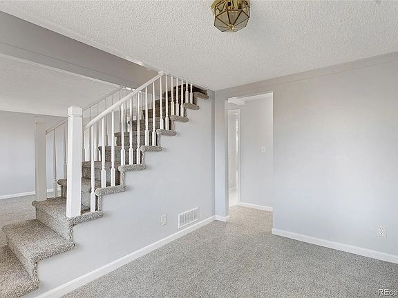 Dining room with stairs leading upstairs to bedrooms