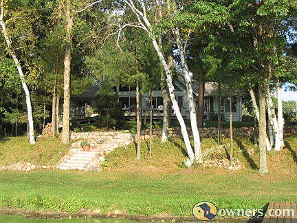 Stone steps to lakeshore with boulder walls
