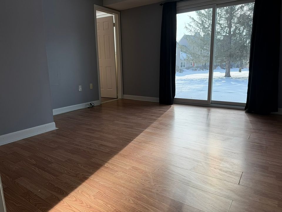 Sunny bedroom with attached bathroom, closet, and direct access to the patio.