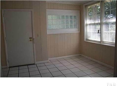GLASS BLOCK WINDOW, TILE FLOOR IN SUNROOM
