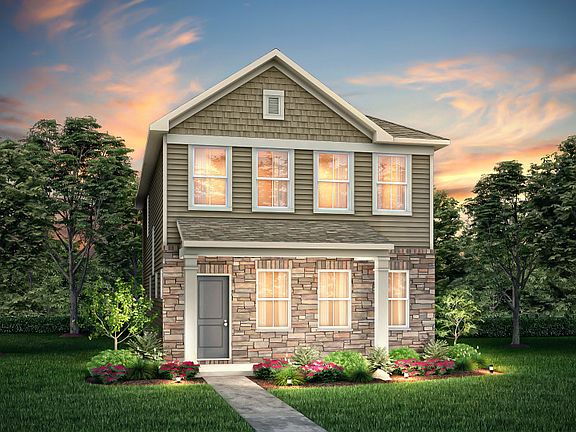 Norman Exterior 7 features siding, stone, covered front sitting porch and 2 car rear load garage