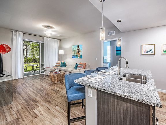 Coralina Apartments | Cape Coral, FL | Sleek Modern Kitchen with Granite Countertops