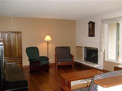 The front room, dining room, entry way and stairs going up are wood laminate.