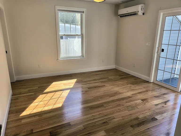 Primary bedroom with heat and AC split unit right in the room plus a slider door out to the main deck area