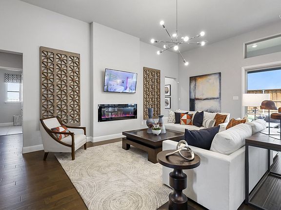 Living room in the Allure home plan by Trophy Signature Homes - REPRESENTATIVE PHOTO