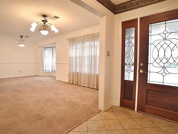 Just off the entry are the formal dining and living rooms!