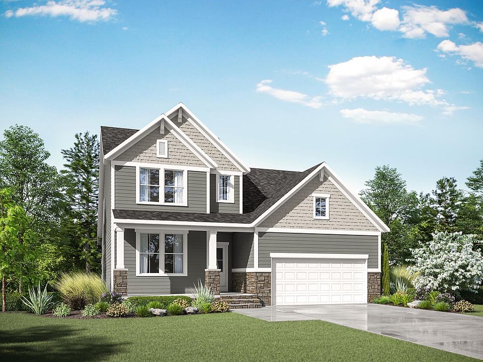 custom home with stone, siding and shakes