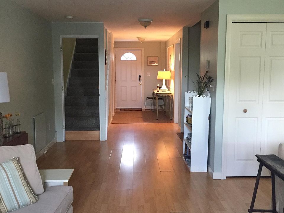 Entryway- washer behind doors. Stairs to bedroom on right.