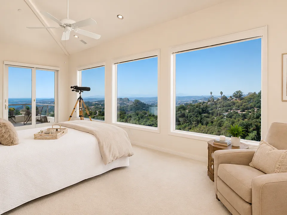 Relax in your primary suite and savor incredible panoramic views spanning from the mountains to the ocean, offering a vantage point that rivals the view from an airplane at over 1,000 feet in the air.