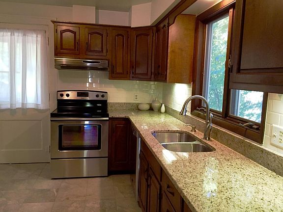 Large kitchen w new appliances, counter tops, tile and paint