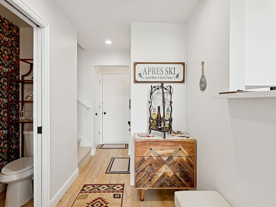 Front door entryway, coat closet, door to the garage, and 1/2 bath on the Main Floor open concept living area.