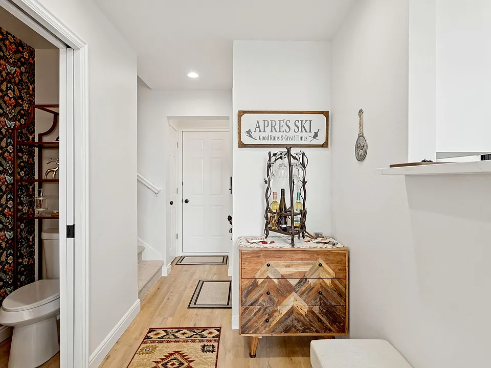 Front door entryway, coat closet, door to the garage, and 1/2 bath on the Main Floor open concept living area.