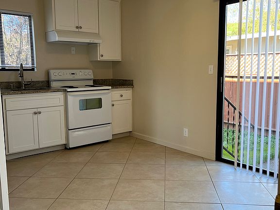 kitchen with sliding door to private back yard