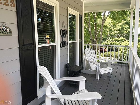 You will love this classic front porch that wraps around the side of the house.