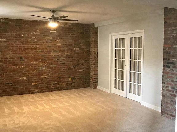 Living room with french doors into den