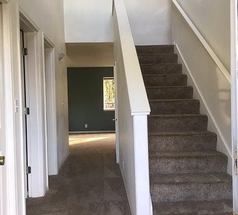 Come into this 2 story town house. Bedroom and Bath to the left, stairs up to the right and straight ahead to the living room. Primary living area in the back of the home providing great privacy!