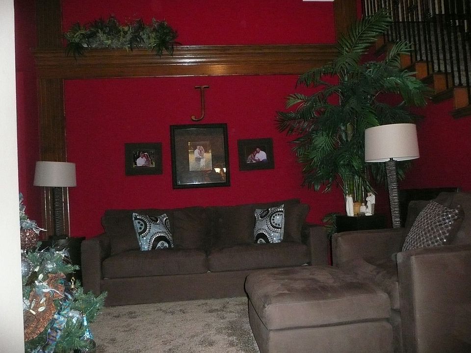  Upon entry, formal living room with decorative paint, plush carpet and custom