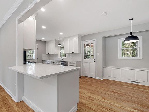 Kitchen with all new cabinets, quartz counters, SS appliances & lighting