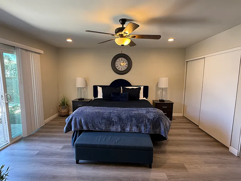 Primary bedroom with 13 ft closet and sliding door to large patio yard. This room is 15 ft x 15 ft.