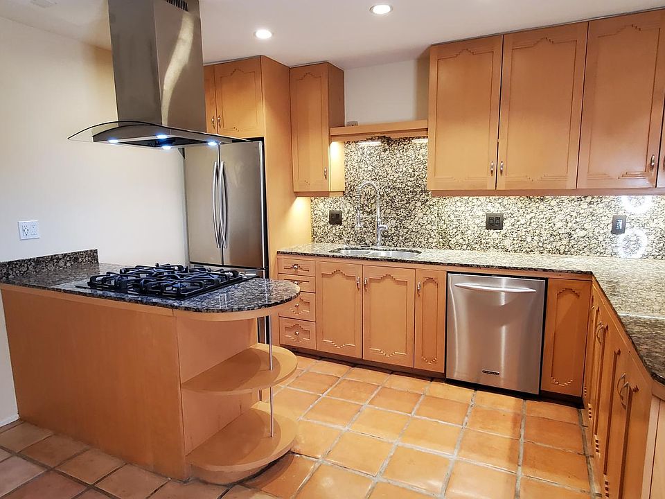 Completely upgraded kitchen; with new low decibel dishwasher, gas range and refrigerator, granite countertops and custom cabinetry. New air conditioning/heating system.