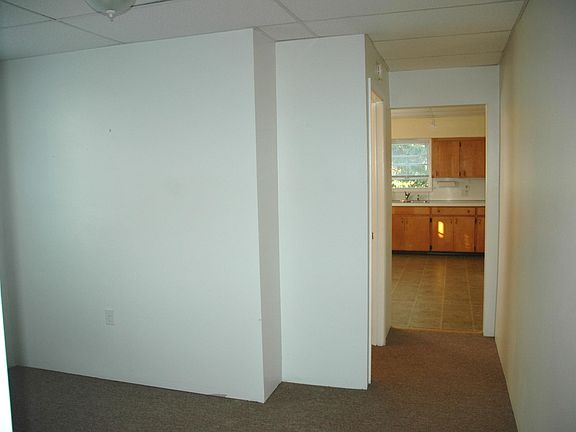 Den/office area .. half bath on left, kitchen view