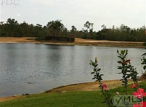 view from lanai of pond & 14 & 15th holes. New grass this Jan...fountain in progress for this lake.