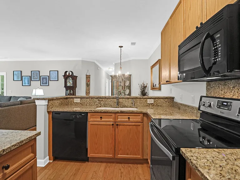 Harmonious granite countertops and classic pine cupboards.
