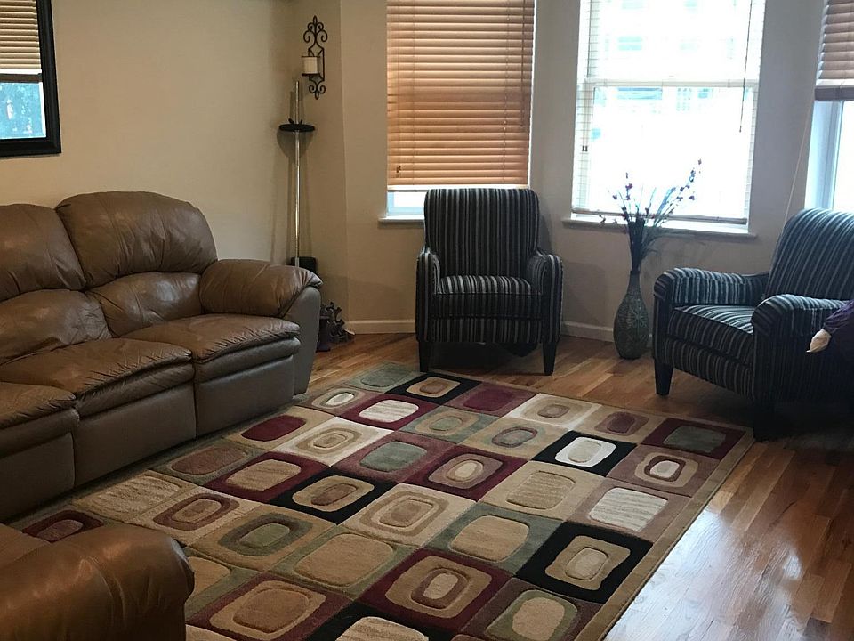 Open floor plan with spacious living room, includes mounted 