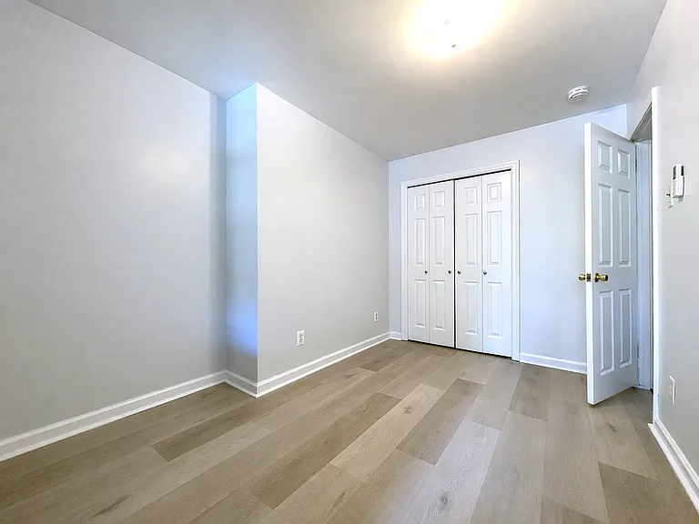 Bedroom with brand new premium flooring and large closet