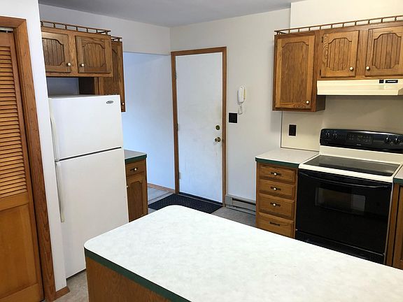Kitchen with door to attached garage