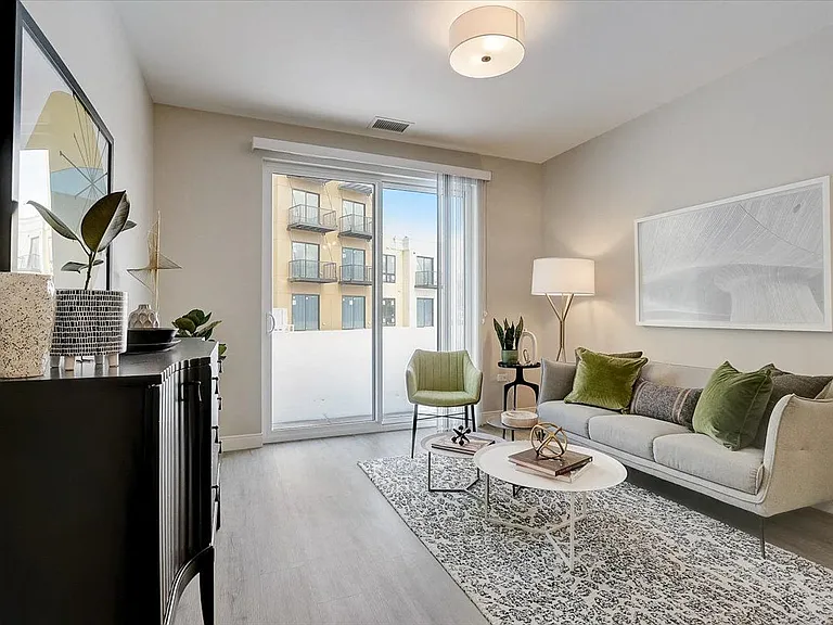Spacious living room that features luxury vinyl plank flooring