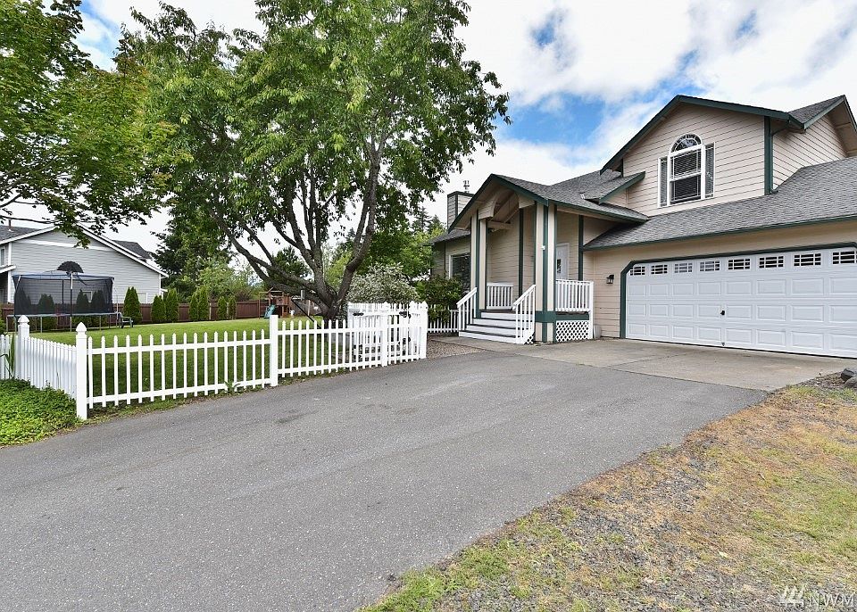 This lovely home has lots of light, arched windows, 3 skylights, is on a lg corner lot with plenty of room for indoor and outdoor living. Relax in the shade of the tree, BarBQ on the big deck, garden. It's within walking distance of Olympic H.S. & just 1.5 miles from Tracyton boat launch.
