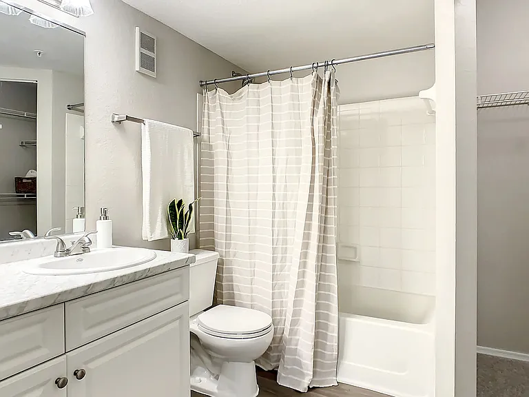 Your oversized primary bathroom offers plentiful storage options including storage drawers, a convenient linen closet as well as a connecting, large walk-in closet.