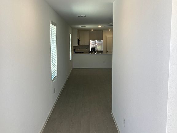 Front Hallway leading to the Family Room, Dining Room, and Kitchen taken from Front Door.