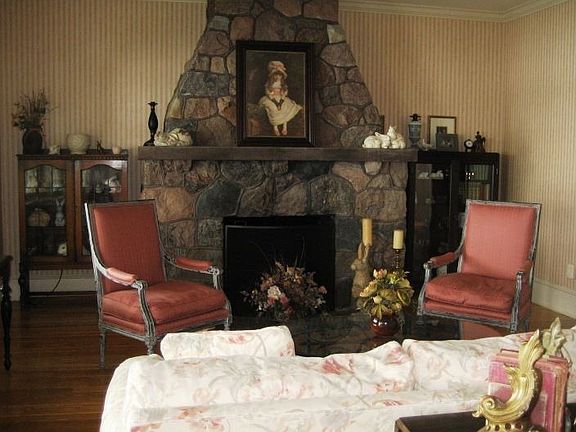 Living Room Overlooking the Lake is Warmed by the Fireplace