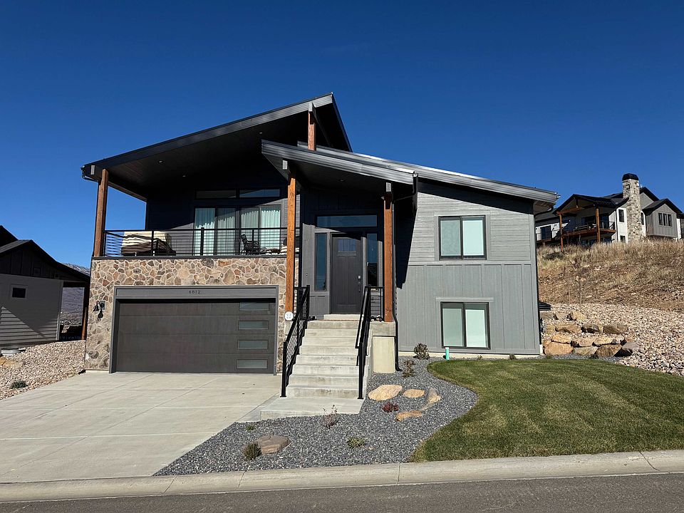 Front of home with two care garage and front porch