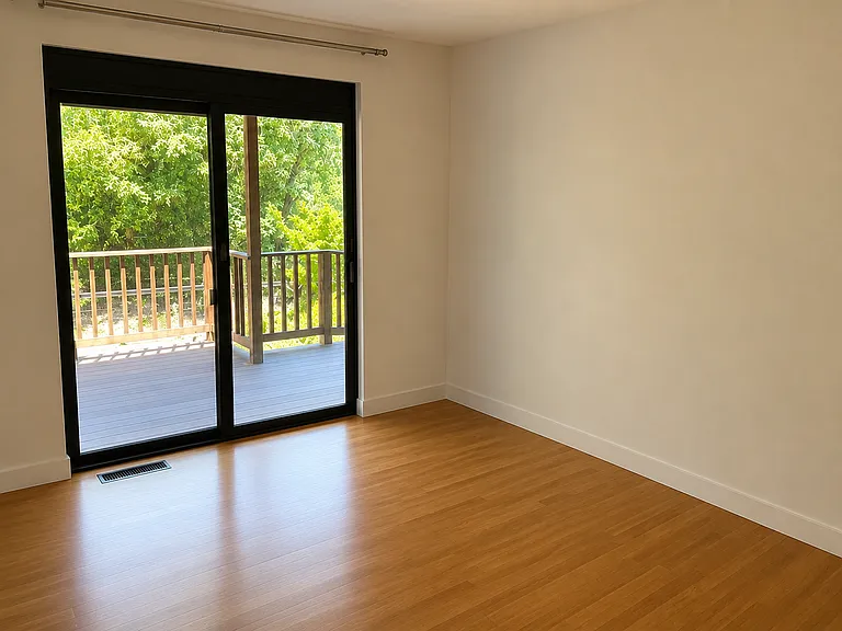Second Bedroom with sliding door to lower deck and back yard