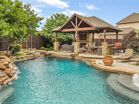 Bask in the glorious Summer evenings by your very own pool-spa with water features and large covered cabana with fireplace and tv.