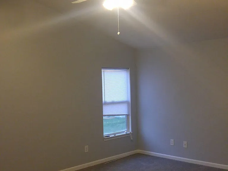 MASTER BEDROOM INCLUDES CEILING FAN NEW GRAY CARPET