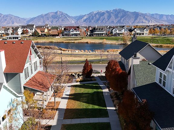 Common area with seating and a fire pit! Oquirrh Lake across the street; mere footsteps.