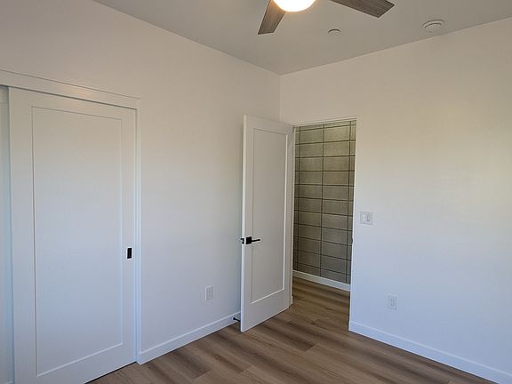 Bedroom #1. Each bedroom has a ceiling fan. The whole unit has central heat and air