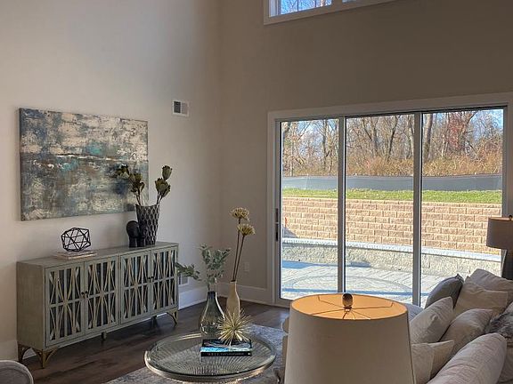 A multi-panel stacking door leads to outdoor living space.