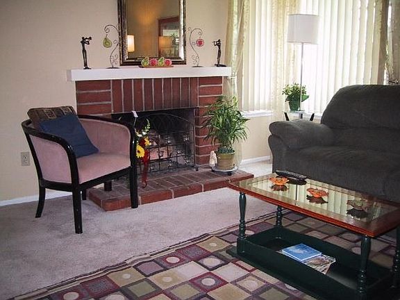 Living Room with Brick Fireplace