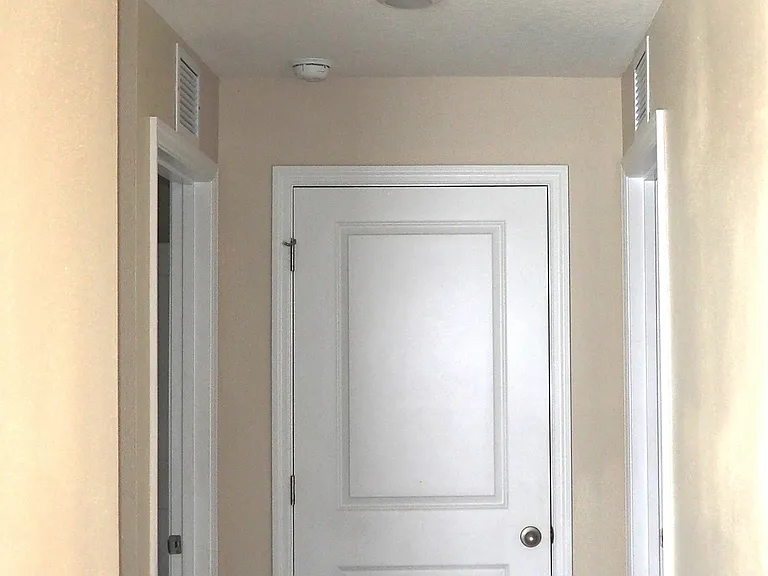 Hall closet, bedrooms to right and left